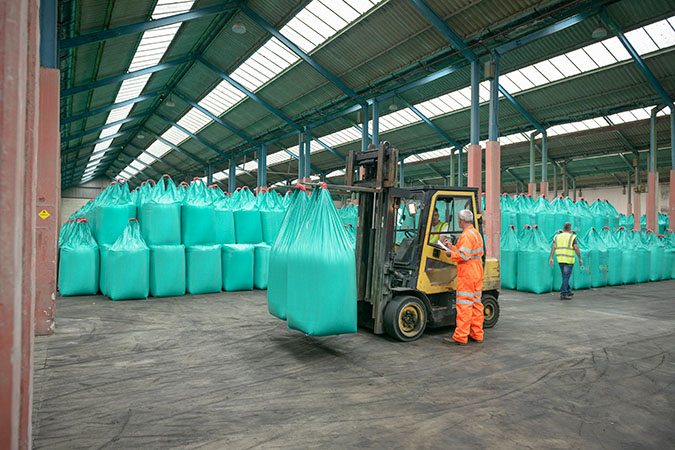 Fertilizer is stored for further blending. 